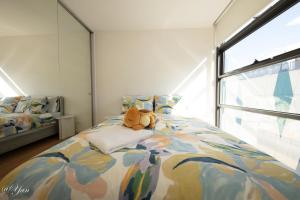 Ένα ή περισσότερα κρεβάτια σε δωμάτιο στο Trainer's Cozy Home - Town of Beginnings マサラタウンのトレーナーのおうち