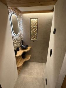a bathroom with a sink and a mirror at TheNEST1895 in Zermatt