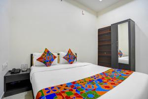 Postel nebo postele na pokoji v ubytování FabHotel Casa