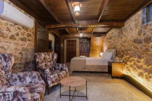 a room with a bed and a couch and a table at Casa Maria Hotel in Antalya