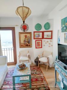 a living room with a couch and a table at La Casuca in Vejer de la Frontera