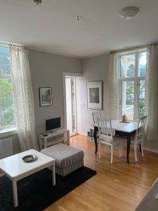 a living room with a table and a dining room at Apartment in Stryn in Stryn