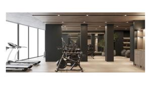 a gym with treadmills and exercise equipment in a room at Swissôtel Marianske Lazne in Mariánské Lázně