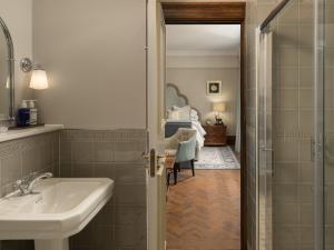 a bathroom with a sink and a mirror at Marcliffe in Aberdeen