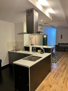 a kitchen with a sink and a counter top at KATO Central 3 - 100m2 - Self check-in - Air Condition in Katowice