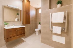 a bathroom with a sink and a toilet at Magnifique Appartement a Dely Brahim in Deli Ibrahim