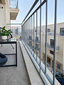 a balcony with a view of a building at Nova in Qala