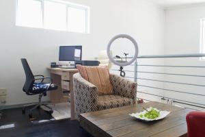 an office with a table and a chair and a desk at Serene escape in Johannesburg in Fourways