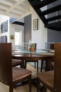a dining room with a table and chairs at Serene escape in Johannesburg in Fourways +44 photos