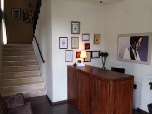a room with a desk and stairs with a stair case at Villa Di Poletta in Dobrich