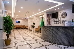a lobby of a store with a waiting room at Luluat Al Badaie Hotel in Mecca