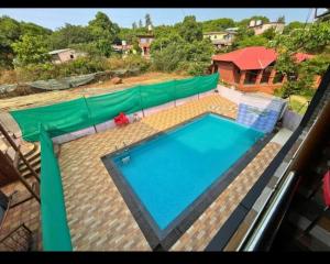 Bazén v ubytování Balaji Excellency Resort nebo v jeho okolí + 7 fotografií