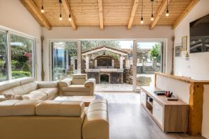 a living room with a couch and a fireplace at Villa Izola in Izola