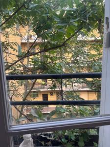 a view of a building through a window at Bedroom in Paris in Paris