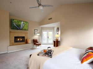 a bedroom with a bed and a fireplace at Luxury Mountain Estate-Pool-Spa-BBQ+Bar-Fire pit in Scottsdale +95 photos