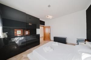 Katil atau katil-katil dalam bilik di Hulù Apartment