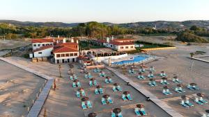 an overhead view of a group of people sitting in chairs on the beach at Tarihi Kumbaba Otel in Sile +123 photos