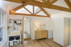 a bathroom with a sink and a window at The Artists Studio Private Parking Frome in Frome