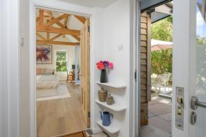 a room with a door leading to a bedroom at The Artists Studio Private Parking Frome in Frome