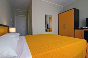 Postel nebo postele na pokoji v ubytování Galileo B&B