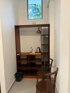 a dressing room with two chairs and a desk at Neilis Villa in Hikkaduwa +19 photos