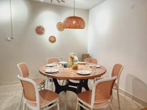 a dining room with a table with chairs and aendant light at NEW! Landed Home in Damansara Jaya for up to 15pax 1 mins to Atria ,1 Utama,TTDI in Petaling Jaya +45 photos