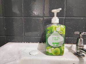 a bottle of soap sitting on top of a sink at NEW! Landed Home in Damansara Jaya for up to 15pax 1 mins to Atria ,1 Utama,TTDI in Petaling Jaya