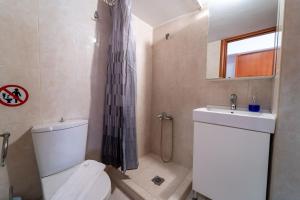 a bathroom with a toilet and a sink at Venetian Studio in the Centre 1 in Heraklio +11 photos