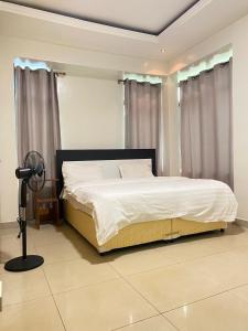 Кровать или кровати в номере Kigali aromas nice apartment