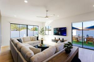 a large living room with a large couch at LUXE - Nouveau - Sparkling Pool - Walk to Old Town in Scottsdale