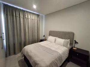 a bedroom with a bed and a large window at Arbre Stay at 1 ON YORK in George +34 photos