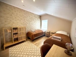 Una cama o camas en una habitación de Riihen Vintti