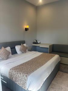 Ένα ή περισσότερα κρεβάτια σε δωμάτιο στο The Aura by Backpackers Stop