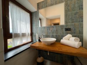 a bathroom with a sink and a mirror at Il Gaudente B&B in Santa Fiora