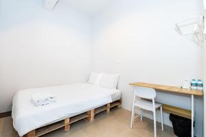 Ένα ή περισσότερα κρεβάτια σε δωμάτιο στο XX The Hidden Khaosan - Rambuttri เดอะ ฮิดเด้น ตรอกข้าวสาร รามบุตรี