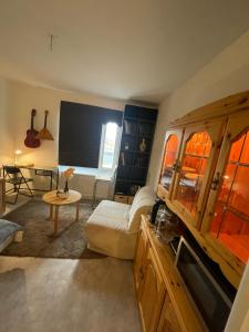 a living room with a couch and a table at Järnvägsgatan 28 in Sundbyberg
