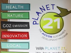 a group of signs with an apple on a wall at ibis Chambery in Chambéry
