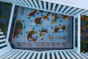 an aerial view of a rock climbing wall on a house at Moxy Alfragide Lisboa in Alfragide