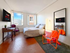 Ένα ή περισσότερα κρεβάτια σε δωμάτιο στο Attico d'Autore in Piazza con Vista Ghirlandina