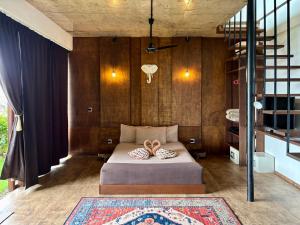 a bedroom with a bed with a pair of shoes on it at Villa JuPITER, Boracay, ocean view holiday home in Boracay