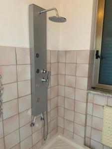 a shower with a glass door in a bathroom at Struttura Religiosa Via Francigena Velletri in Velletri