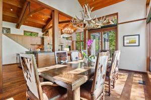 a dining room with a wooden table and chairs at RMR: Timbers at Granite Ridge 3100 in Teton Village in Teton Village