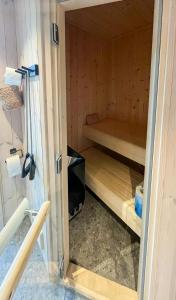 a small room with a bunk bed and a television at Architect-Designed Cabin With Views Of Sigdal in Skadeland +32 photos