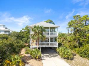 an aerial view of a house with palm trees at Cape Palms in Port Saint Joe