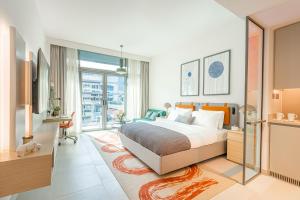 Ένα ή περισσότερα κρεβάτια σε δωμάτιο στο Bloom Arjaan by Rotana