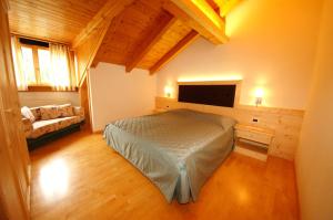 Postel nebo postele na pokoji v ubytování Hotel La Müda