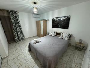 a bedroom with a bed with a teddy bear on it at Aguasoleil in Saint-François