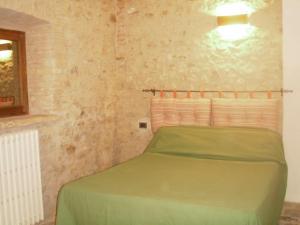 A bed or beds in a room at Agriturismo Le Vigne di Pace
