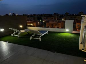 a view of a rooftop with a green lawn at Villa Margarita, Guardamar Del Segura in Guardamar del Segura