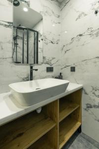 Vannituba majutusasutuses Colorful Apartments Y